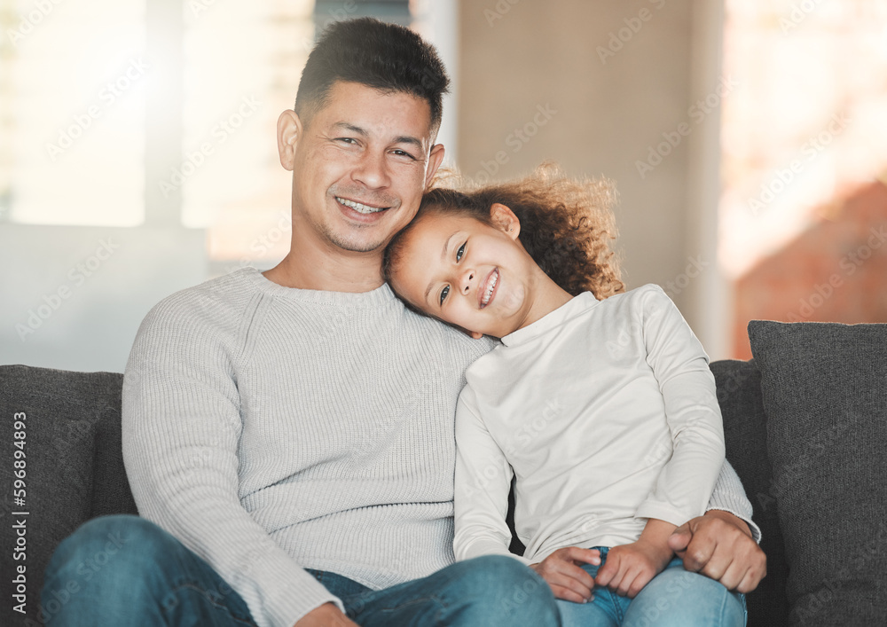 Wall mural We are family. Shot of a father and daughter on the sofa at home.