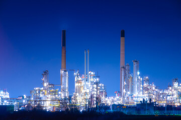 View of the plant at night. Industrial landscape. Production. Heavy industry. Processing of oil and gas.  Industrial area in the evening.