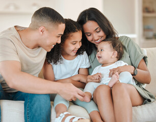 The man I wanna be, they made me. Shot of a beautiful family bonding on a sofa at home.