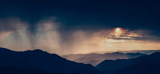 Foto op Plexiglas Mistige ochtendstond banner of mountain peaks in beautiful stormy sunset light