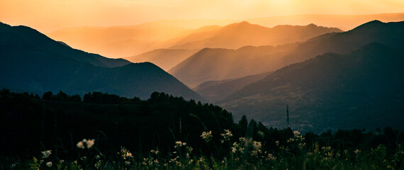banner of mountain peaks in beautiful sunset light