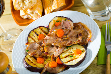 Barbecued lamb chops served with grilled aubergine and carrot