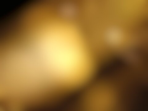 Abstract blur background image of gold color gradient used as an illustration. Designing posters or advertisements.