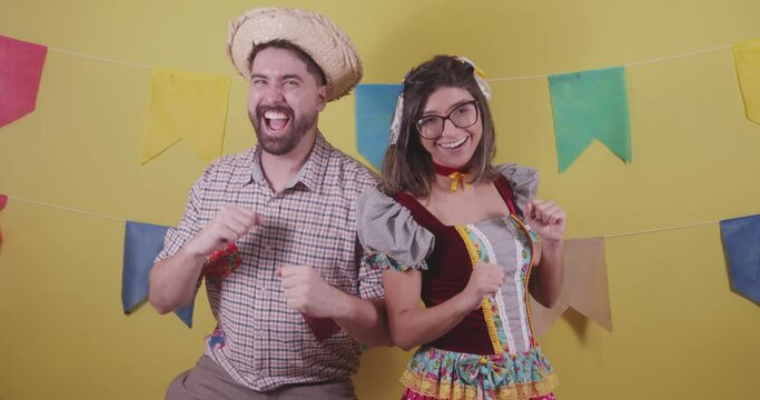 Brazilian couple, dressed in Junina party clothes, S&atilde;o Jo&atilde;o party. Protocol scenes.