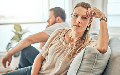 One young woman feeling frustrated and annoyed after an argument with her husband. A wife feeling distant after fighting due to marriage problems. A negative situation that could end up in divorce - obrazy, fototapety, plakaty