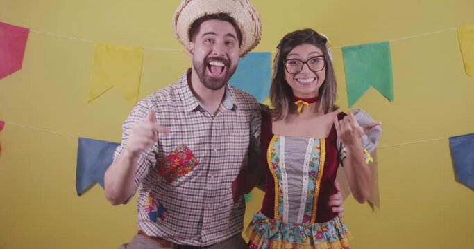 Brazilian couple, dressed in Junina party clothes, S&atilde;o Jo&atilde;o party. Protocol scenes.