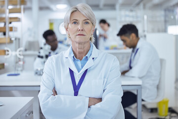 Ready to get to work. Shot of a proud mature female scientist in the lab.