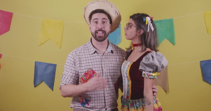 Brazilian couple, dressed in Junina party clothes, S&atilde;o Jo&atilde;o party. Protocol scenes.