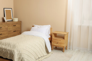 Fototapeta na wymiar Stylish room with comfortable bed. Interior design