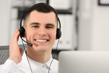 Hotline operator with headset working in office, space for text