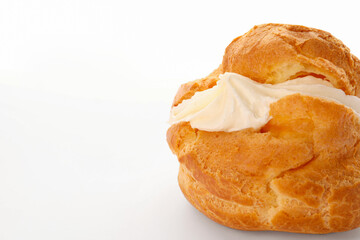 Delicious profiterole with cream filling isolated on white