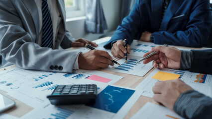 Team of male bookkeepers people working with balance sheet to analyze problems and find solutions to develop business organization and company's stock market system. Common stock and preferred stock