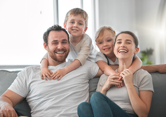 Rejoice with your family in the beautiful land of life. Shot of a young couple spending time with...
