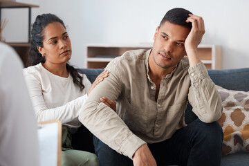 You have the support of the ones you love. Shot of a young couple sitting together and looking...