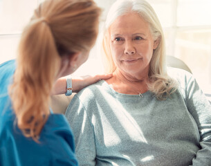 Help others get what they need. Shot of a senior woman being supported by her nurse at home.