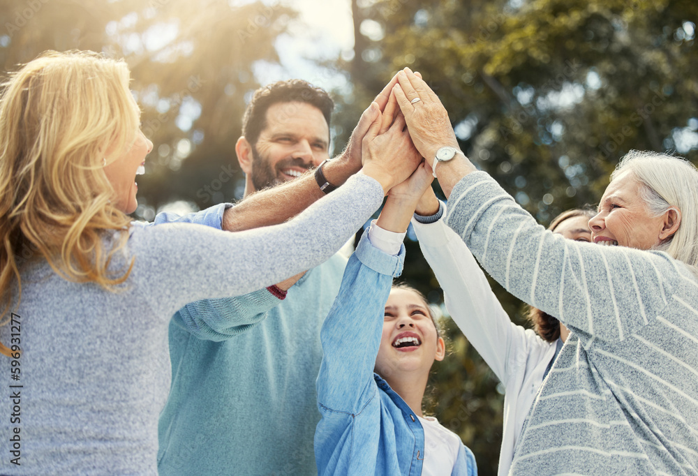 Canvas Prints Love your family as you love yourself. Shot of a family giving each other a high five in the garden at home.