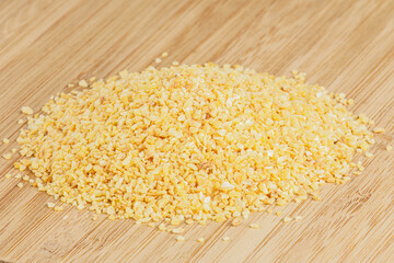 Minced Garlic isolated on a wooden cutting board