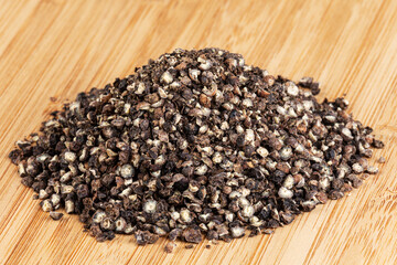 Peppercorn isolated on a wooden cutting board