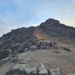 trekking path to the top of a rocky mountain in La Molina city in Peru