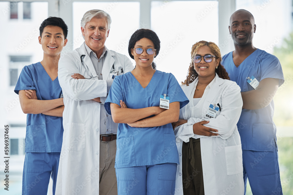 Wall mural We are each competent and have a vital contribution to share. Portrait of a group of medical practitioners standing together with their arms crossed in a hospital.