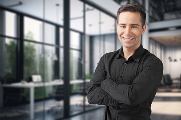 Portrait of a young businessman standing in the office,