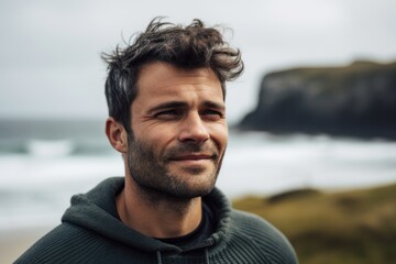Obraz na płótnie Canvas Close-up portrait photography of a pleased man in his 30s wearing a cozy sweater against an island or beach paradise background. Generative AI