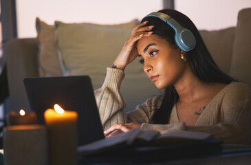 These deadlines creep up on you so fast. Cropped shot of an attractive young woman working late at...