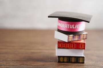 Graduation hat on book with copy space, learning university education concept.