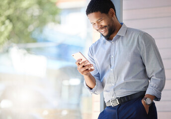 Getting ahead of the game with his connections. Shot of a young businessman using a cellphone in an office.