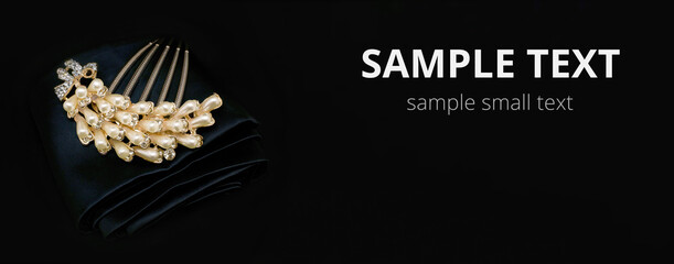 Golden jewelry with gemstone , mockup for copy space and design. Isolated on black cloth background