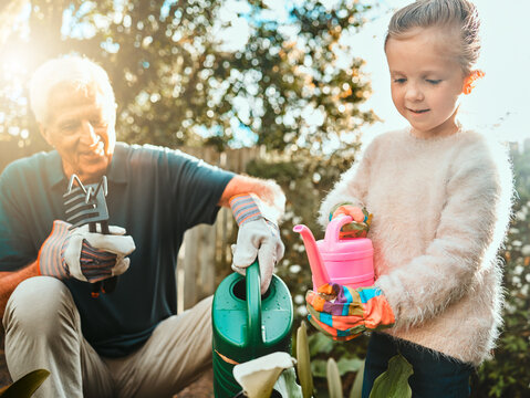 There are no gardening mistakes, only experiments. Shot of an adorable little girl gardening with her grandfather.