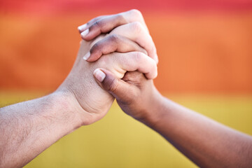 We want the best for one another. Shot of two protestors joining hands in unity during a protest.