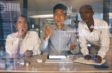Great minds coming together. Shot of a group of businesspeople working late in a modern office.