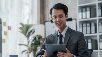 Fototapeta premium Profile of the firm's accountant for company registration, bookkeeping, asian people working with Deferred Incomes, Drawing Account, stock market, Depletion, Doubtful Debt, Equivalent Units