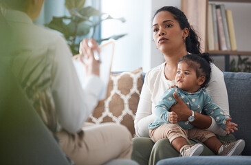 This is a normal reaction. Shot of an attractive young woman sitting with her daughter during a consultation with a psychologist. - Powered by Adobe
