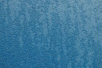 ざらざらで青いモルタルの壁のテクスチャー背景