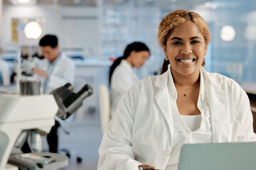 She never misses an opportunity. Shot of a young female lab technician in her office.