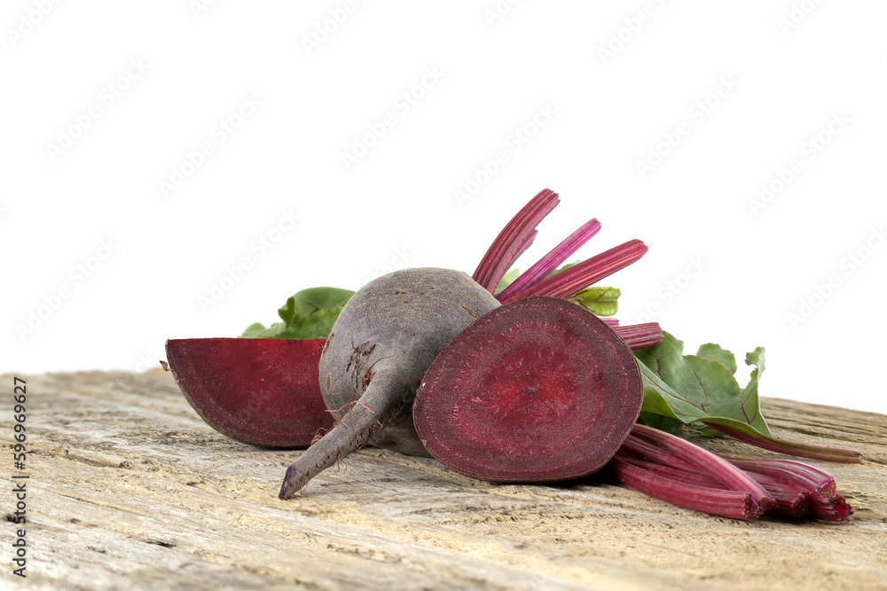 Wall mural beetroot with green leaves on grey rustic wood