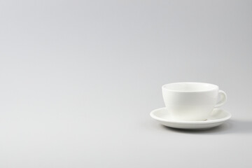 white ceramic cups on isolated white background