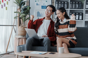 Obraz premium Good news by mail. Happy married asian chinese couple sit at home office by paperwork business accounting. Glad young spouses read financial report get profit tax refund check information using laptop