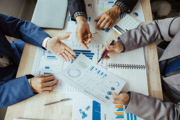 Team of business people in a meeting to analyze business growth plans for future new business expansion using laptop computers and tablets for work