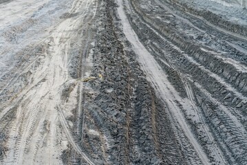 clay mud road with tyre marks in india