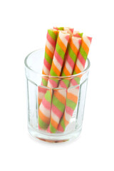 Wafer stick roll in glass isolated on white background. colorful wafer stick rolls.