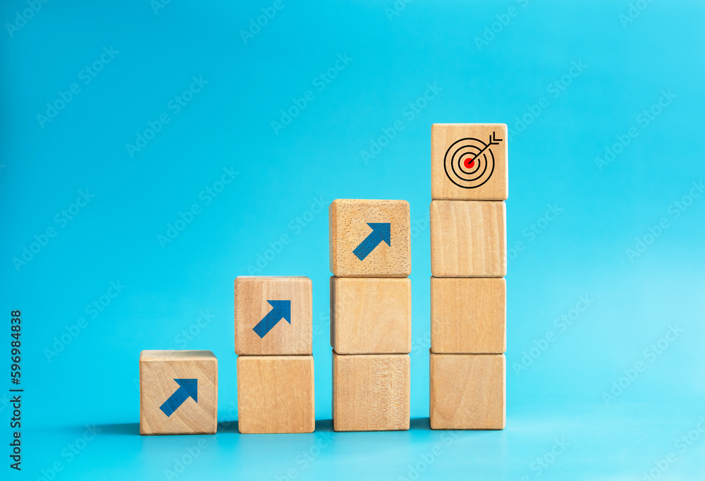 Poster goal and success. arrow dart, target icon on top of wooden cube blocks, bar graph steps with up arro