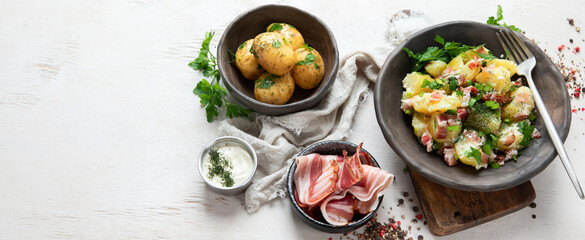 Kartoffelsalat - traditional German potato salad. Potato salad with bacon.