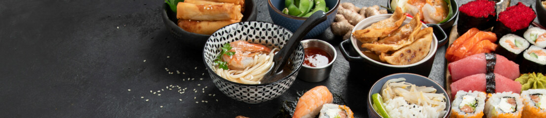 Traditional Japanese food dishes on black background