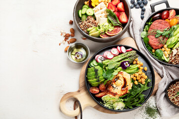 Healthy vegetarian and vegan  salads and Buddha Bowls with vitamins, antioxidants, protein on light  background.