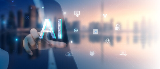 Businessman pressing artificial intelligence (AI) icon on virtual screen.