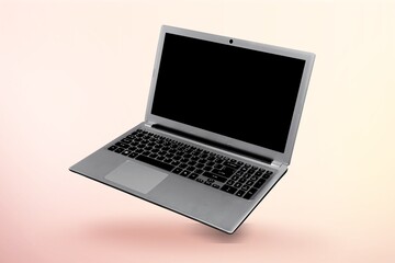 Modern laptop computer on color background