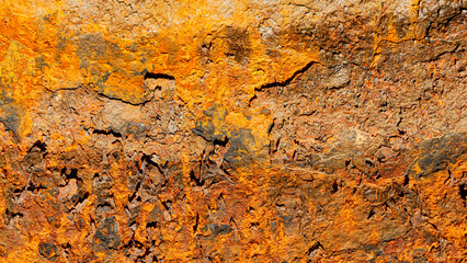Rust of metals.Corrosive Rust on old iron with a hole. Rusted orange painted metal wall. Rusty metal background with streaks of rust. Old shabby paint.metal rust texture background.